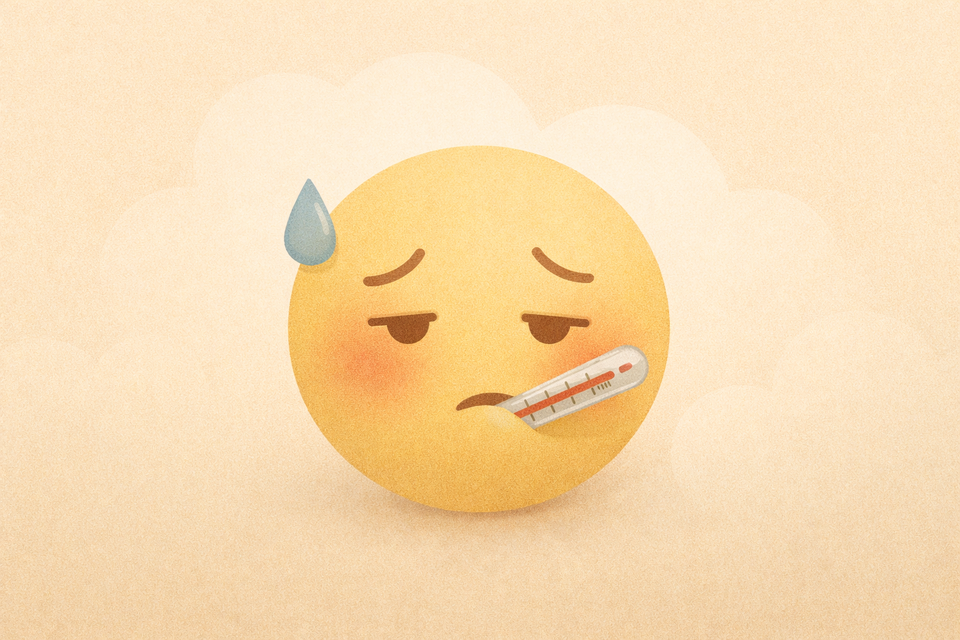 An illustration of a sick smiley face with tired eyes, a thermometer in the mouth.
